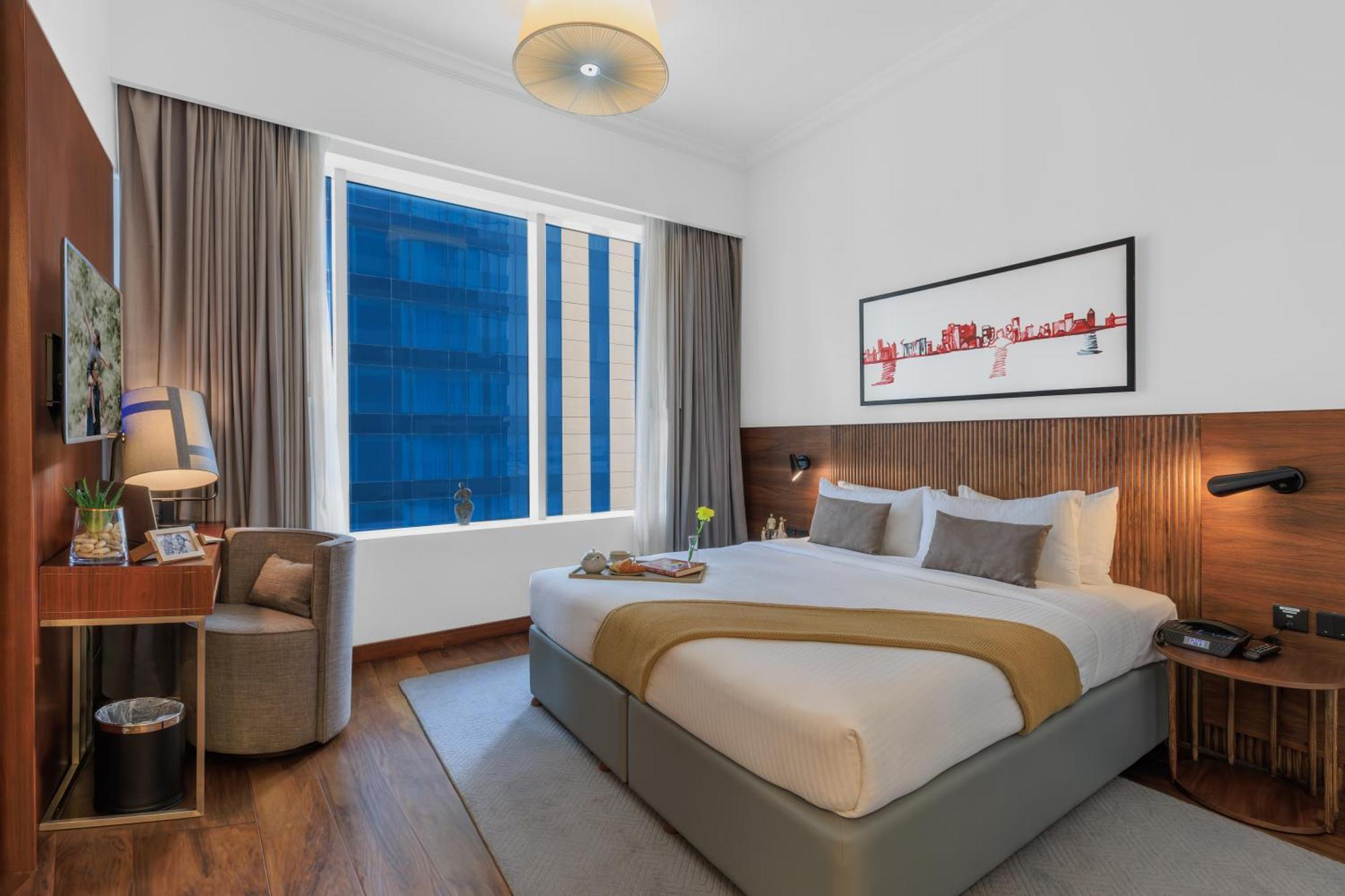 서머셋 웨스트 베이 도하 호텔 외부 사진 A bedroom at the hotel